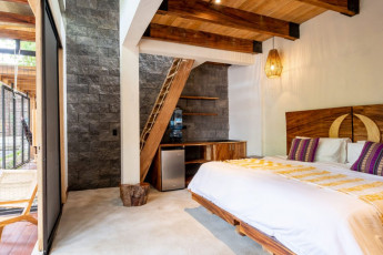 002-Mango-Suite-King-Bed-to-Kitchenette-and-Loft-Stairs-Nice